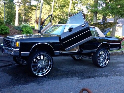 85 caprice lambo doors, 28's, candy paint, big custom lift, done right!