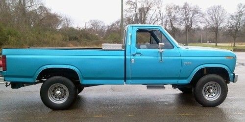 1984 blue ford f250, 4x4; excellent condition, low mileage, goose neck hook up.