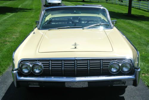 Yellow with black convertible top, black leather interior