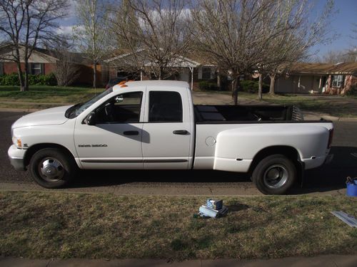 4 door dually.  5th wheel hitch. white with gray cloth int.