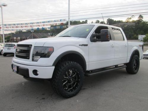 Unique lifted and loaded f-150 fx4 nav rr camera sun roof tow spray- in bedliner