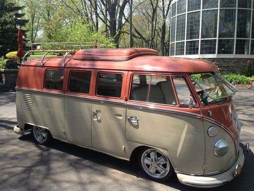 Beautiful customized vw bus w/ pop-out windows and camper pop-top