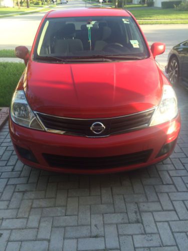 Red nissan versa 2011. 49, 200 on milage. new tires, tinted windows, only owner