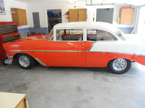 Hugger orange and white 1956 chevrolet that looks awesome !!!