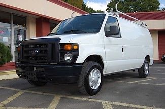 Very nice ford e-150 cargo van equipped with ladder racks and work bins!