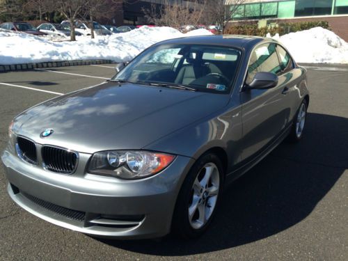 128i coupe, premium package, automatic, gray/black leather still has warranty