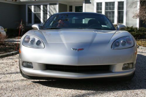 Corvette 2006 c6 one owner 38k mls. garage kept machine silver red leather int.