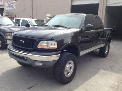 No reserve!!! clean title. fully lifted. leather. 5.4l v8. crew cab. lariat.
