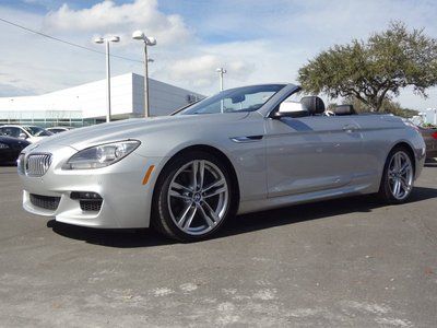 Executive demo convertible $946 / mo lease, $103845 msrp, clean carfax 12