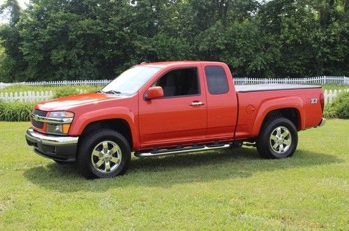 Inferno orange 2lt very nice we finance four wheel drive 4wd ext cab a/t a/c tow