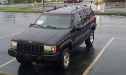 Grey and black 1998 jeep grand cherokee