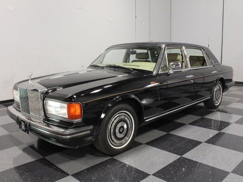Beautiful black, 59k actual miles, meticulously cared for, bar in the back!!!