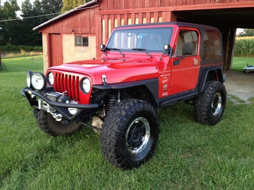 77,777 miles! tj sport 6" lift 36's loaded w/high end parts 2 tops manual 4.0