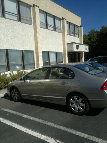 Ivory four door honda civic