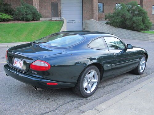 Xk8 in british racing green; second owner, complete and original.