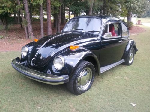 This bugs exterior is black with red interior all new,and also new tires........