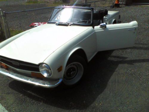 Newly restored white tr6 with custom interior