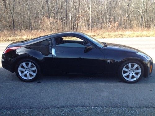 Supercharged 350z low miles, very fast, black on black!