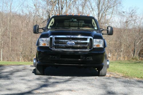 2007 f-550 black w/leather interior, tuscany converversion includes air ride