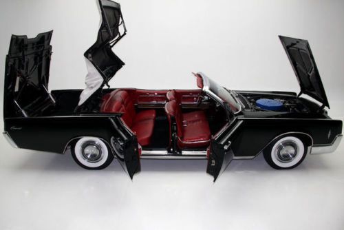 1966 jet black lincoln continental with suicide doors