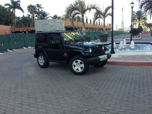 2012 jeep wrangler sahara with hard top, navigation package and towing package1