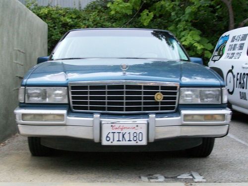 1993 sedan deville lowrider with weathered patina paint treatment
