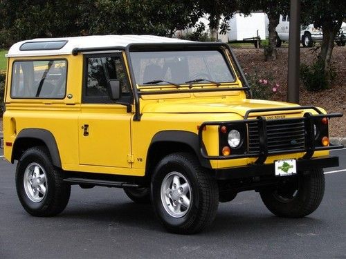 Adventuremotorcars presents aa yellow 1995 defender 90 low miles