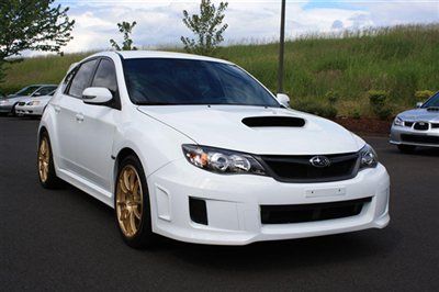 2008 subaru impreza wrx sti. with a 2011 sti front bumper and 18 inch wheels.