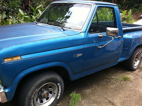 This is a 1986 ford f150 step-side pickup, blue in color. this is a project !!!