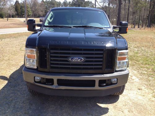 2008 ford f250 super duty 4 x 4 offroad edition with leer camper shell.