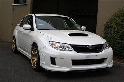 2013 subaru impreza wrx. a brand new car, with only 671 miles. new 18 inch wheel