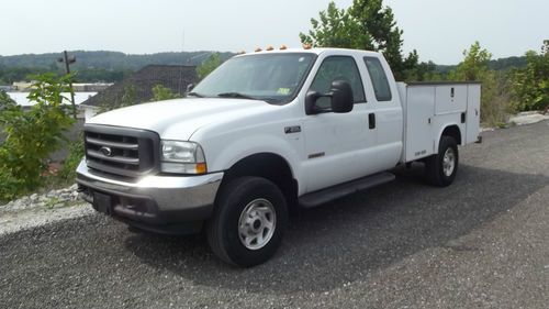 2004 ford f350 6.0 diesel 4x4 ex cab with a utility bed