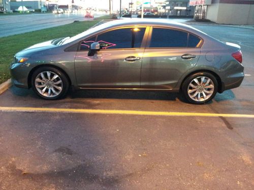 12 honda civic: like new with 2 sets of wheels/tires super low miels: sharp