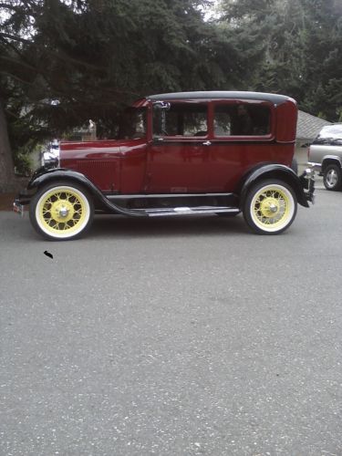 Beautifully restored 1929 ford tudor    burgundy with yellow spoke wheels !
