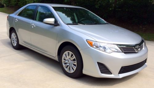 2014.5 toyota camry - auto 4dr - l series - has new car smell - under 250 miles!
