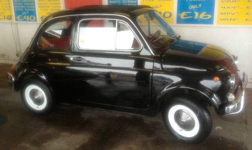 1968 fiat 500 black with red interior. beautiful car and delivery service offer