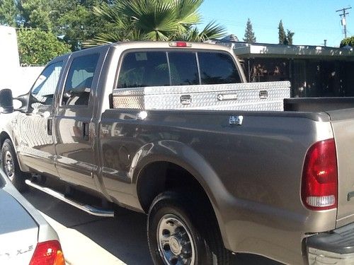 Gold ford f250 xlt diesel crew cab with hitch wiring for towing