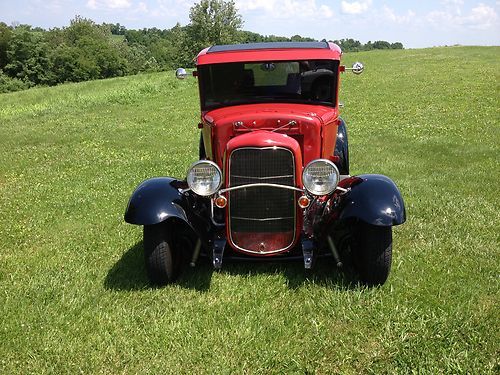 1931 ford model a 5 window coupe: red, black fenders, only 150 miles