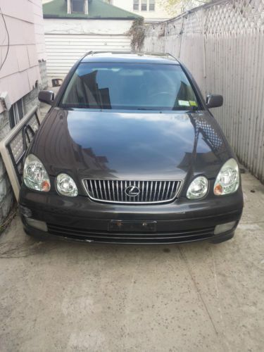 A used 2003 lexus gs300 with black leather interior gps chrome wheels low miles