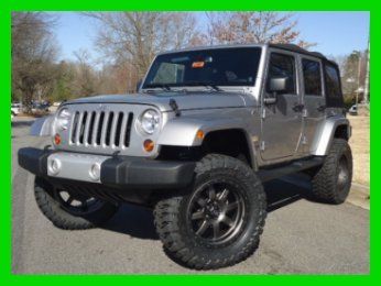 3.6l auto rubicon express lift 35in tires 20in fuel trophy wheels navigation sat