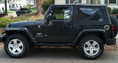 2010 jeep wrangler sahara, factory hard top and a new soft top, hitch, like new