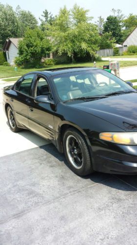 2002 black pontiac bonneville ssei and factory set of rims included with sale.