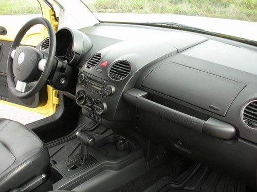 Yellow vw new beetle, 6-spd auto, black interior, 5-cylinder gas engine, gc