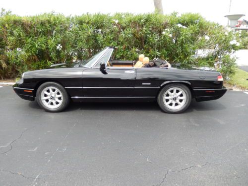 1991 alfa romeo spider  black with tan and all accessories work as they should.