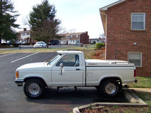 1990 4x4 white ford ranger.