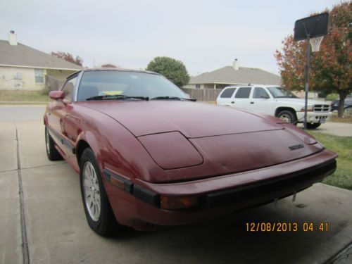 Red 1985 mazda rx7 with 13b motor