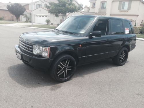 2004 black range rover with original rims. (rims pictured for an extra amount)