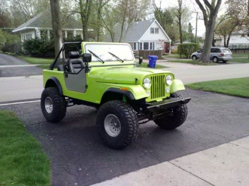 1991 jeep wrangler with a cj front clip green in color frame off restore