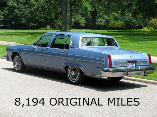8,194 original miles, 350 cid v-8, showroom new, light blue metallic, 98 regency