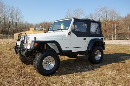 Very cool 1997 jeep wrangler  lift..33" wheels/tires  5 speed manual, 2.5 liter